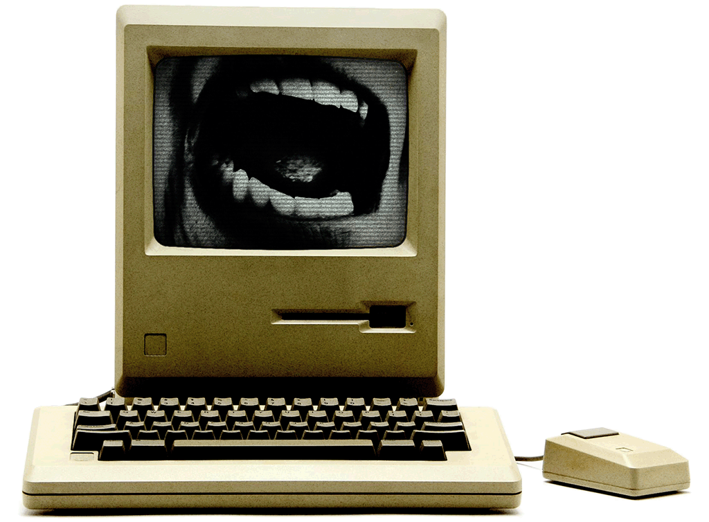 Retro computer with screaming mouth on-screen